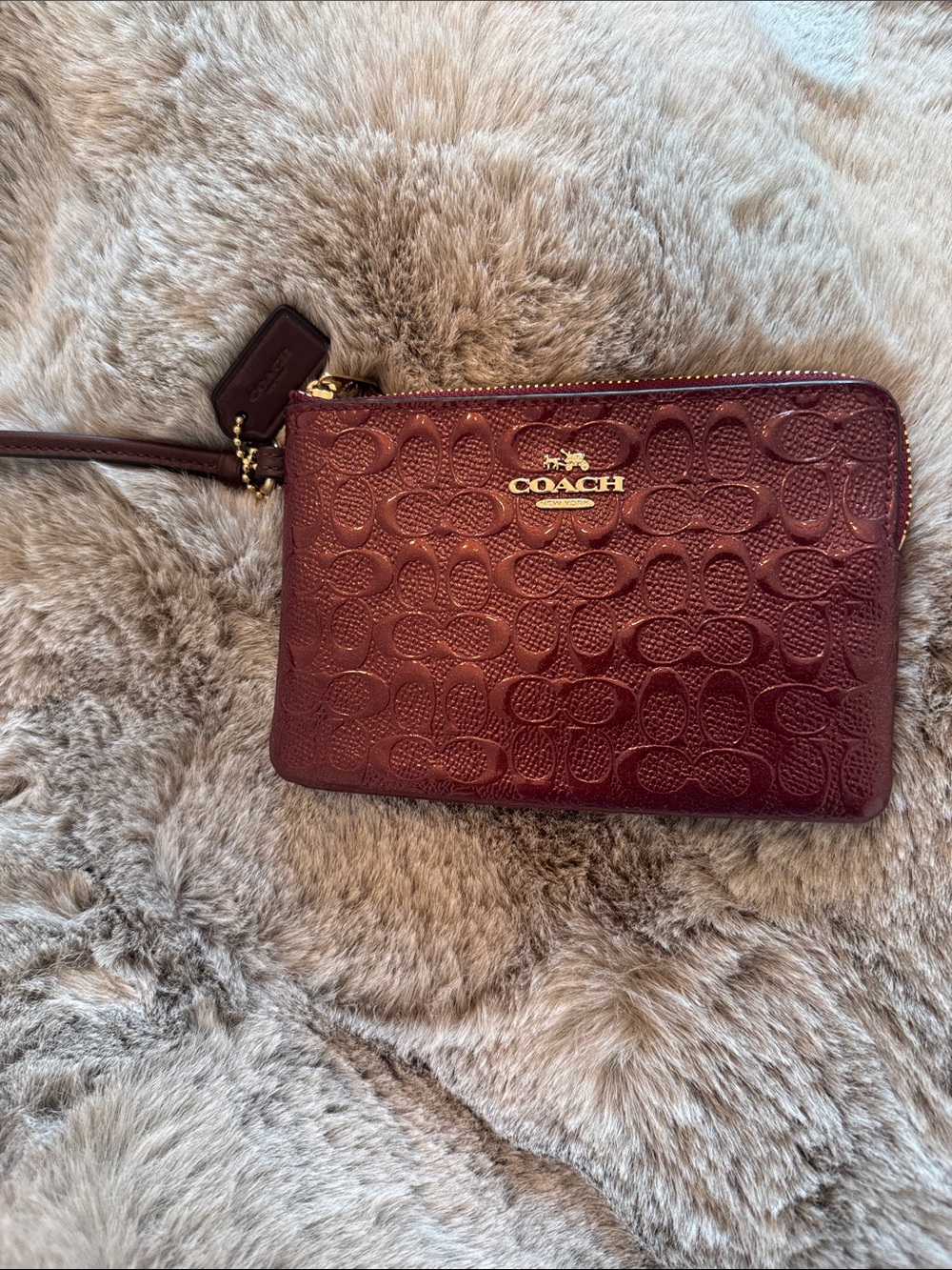COACH Authentic Wine Embossed Signature Leather Wristlet with Gold Hardware